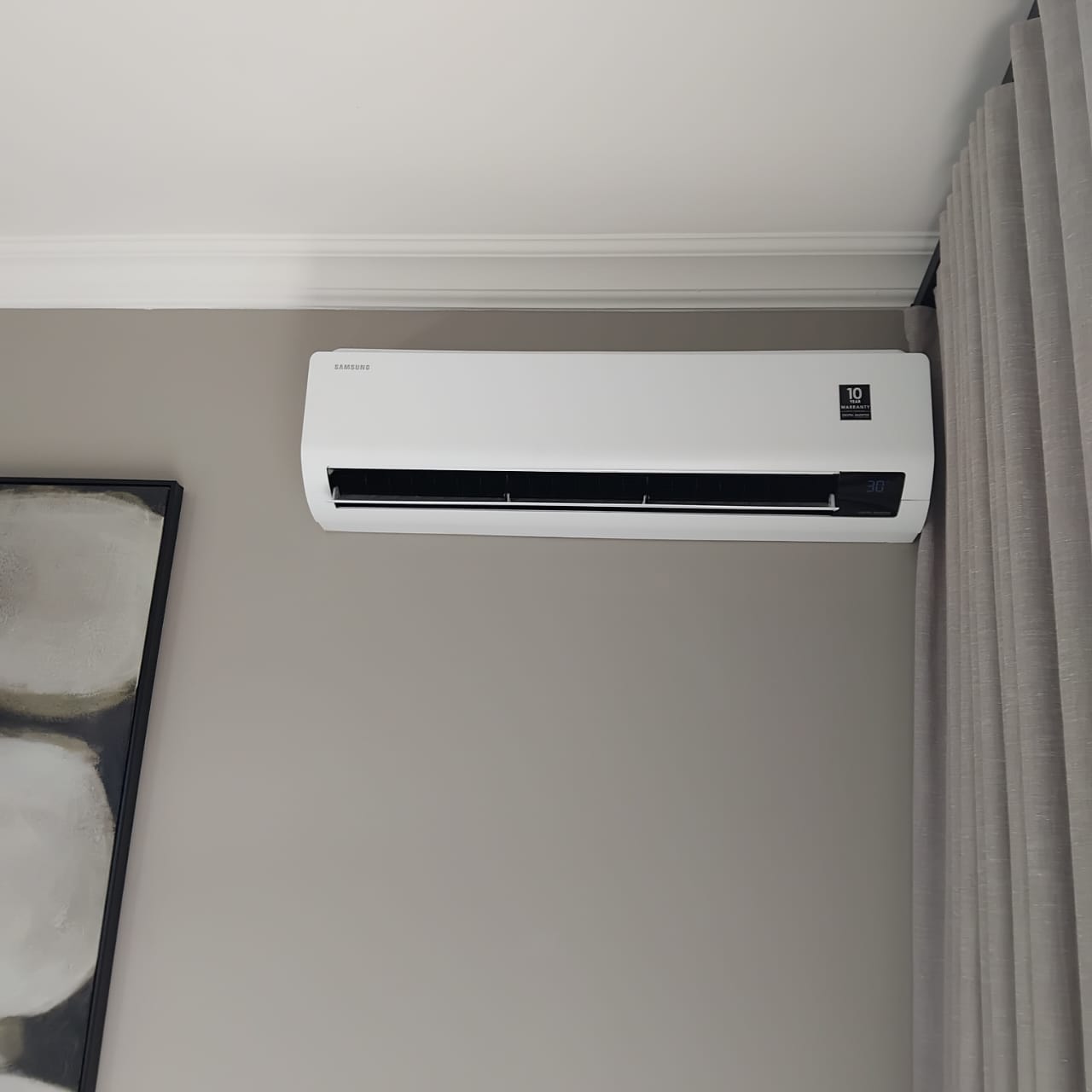 Aircon technician working on an air conditioning system in Cape Town